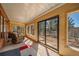 Covered porch featuring wood ceiling, views, and natural light at 767 Tenderfoot Dr, Larkspur, CO 80118
