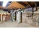 Unfinished basement with a water heater and utilities, offering plenty of potential at 3931 King St, Denver, CO 80211