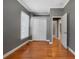 Comfortable bedroom featuring a closet, neutral paint, hardwood floors, and windows with blinds at 3931 King St, Denver, CO 80211