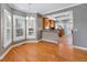 Bright dining area with multiple windows, seamlessly connecting to the open kitchen layout at 3931 King St, Denver, CO 80211