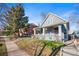 Beautiful home with a covered porch and well-manicured front lawn, great curb appeal at 3931 King St, Denver, CO 80211