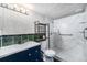 Bathroom with a sleek vanity, modern fixtures, and walk-in shower, offering a spa-like experience at 9712 Adams St, Thornton, CO 80229