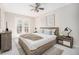 Comfortable bedroom featuring a plush bed, soft lighting, and balcony access, perfect for relaxation at 9712 Adams St, Thornton, CO 80229