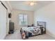 Cozy bedroom with a sliding closet door, ceiling fan, toys, and carpet floors at 9758 Laredo St # 1E, Commerce City, CO 80022