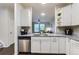 Modern kitchen with stainless steel appliances, granite countertops, and view to the living room at 9758 Laredo St # 1E, Commerce City, CO 80022