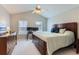 Spacious main bedroom featuring a king bed, high ceilings, and ample natural light at 9758 Laredo St # 1E, Commerce City, CO 80022