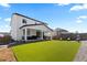 Spacious backyard with artificial turf, gravel landscaping and covered patio at 140 Vista Cliff Cir, Castle Rock, CO 80104