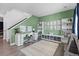 Bright office/bedroom featuring a work space, shelving, and hardwood floors, bathed in natural light at 140 Vista Cliff Cir, Castle Rock, CO 80104