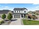 Traditional two-story home with large driveway and landscaped front yard at 140 Vista Cliff Cir, Castle Rock, CO 80104