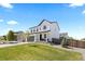 Charming two-story home features manicured front yard and a two-car garage at 140 Vista Cliff Cir, Castle Rock, CO 80104