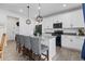 Bright kitchen featuring a center island with seating, pendant lighting, and stainless steel appliances at 140 Vista Cliff Cir, Castle Rock, CO 80104
