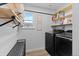 Laundry room with black washer and dryer at 140 Vista Cliff Cir, Castle Rock, CO 80104