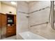 Bright bathroom featuring a soaking tub with built in towel storage at 2880 S Locust St # 505N, Denver, CO 80222