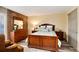 Spacious bedroom with stylish brick accent wall, comfortable bed, and ample closet space at 2880 S Locust St # 505N, Denver, CO 80222