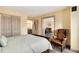 Comfortable bedroom with neutral tones, plush bed, bathroom and office access at 2880 S Locust St # 505N, Denver, CO 80222