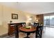 Dining area offers a cozy space for meals, enhanced by wood-look floors and natural light at 2880 S Locust St # 505N, Denver, CO 80222