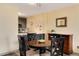 Bright eat-in kitchen and dining area featuring updated cabinetry and wood-look flooring at 2880 S Locust St # 505N, Denver, CO 80222