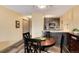 Charming dining area adjoins the kitchen, featuring sleek wood-look floors and neutral colors at 2880 S Locust St # 505N, Denver, CO 80222