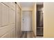 Apartment entryway features closet, door, and stainless steel refrigerator at 2880 S Locust St # 505N, Denver, CO 80222