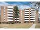 Brick apartment building showcases multiple balconies and well-kept lawns at 2880 S Locust St # 505N, Denver, CO 80222