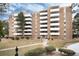 Apartment building featuring balconies and maintained green spaces at 2880 S Locust St # 505N, Denver, CO 80222