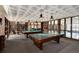 Community game room featuring billiards and ping pong tables with ample windows for light at 2880 S Locust St # 505N, Denver, CO 80222
