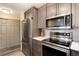 Modern kitchen featuring stainless steel appliances, white quartz countertops and grey cabinets at 2880 S Locust St # 505N, Denver, CO 80222