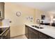 Modern kitchen featuring stainless steel appliances, white quartz countertops and chrome faucet at 2880 S Locust St # 505N, Denver, CO 80222