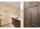 Modern kitchen with stainless steel appliances and ample storage in the wood cabinets at 2880 S Locust St # 505N, Denver, CO 80222