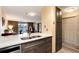 Modern kitchen with stainless steel appliances and ample storage in the wood cabinets and drawers at 2880 S Locust St # 505N, Denver, CO 80222