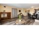 Open floor plan connects the living room, dining area and kitchen with sleek wood-look floors at 2880 S Locust St # 505N, Denver, CO 80222