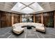 Spacious lobby area features skylights, seating, and decorative wood panels at 2880 S Locust St # 505N, Denver, CO 80222