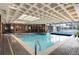 Indoor community pool featuring ample lighting and a hot tub at 2880 S Locust St # 505N, Denver, CO 80222