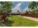 Large, level backyard with a full lawn, brick patio, and privacy fencing at 3182 W 29Th Ave, Denver, CO 80211
