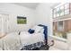 Bright bedroom enhanced by a decorative stained glass window at 3182 W 29Th Ave, Denver, CO 80211