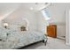 Attic bedroom with carpet, skylight, and natural light and a dresser at 3182 W 29Th Ave, Denver, CO 80211
