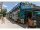 Exterior of a blue and brick coffee shop with a patio and ample seating at 3182 W 29Th Ave, Denver, CO 80211