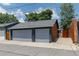 Two car detached garage with concrete driveway and alley access at 3182 W 29Th Ave, Denver, CO 80211