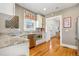Kitchen featuring granite countertops, stainless steel appliances, and hardwood floors at 3182 W 29Th Ave, Denver, CO 80211