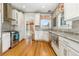 Bright kitchen featuring stainless steel appliances, granite counters, and hardwood flooring at 3182 W 29Th Ave, Denver, CO 80211