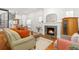 Bright living room with a cozy fireplace and spiral staircase at 3182 W 29Th Ave, Denver, CO 80211