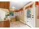 Sunny sun room with tile floor, backyard access, and cozy, cheerful décor at 3182 W 29Th Ave, Denver, CO 80211