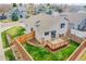 Aerial view of the backyard with wood fence, a wooden deck, and a grass area with landscaping at 598 Arden Cir, Highlands Ranch, CO 80126