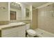 Compact bathroom featuring a vanity, shower, and neutral tile at 598 Arden Cir, Highlands Ranch, CO 80126