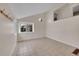 Bright room with neutral walls, tiled floor and a large window at 598 Arden Cir, Highlands Ranch, CO 80126