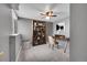 Bright bedroom with a fan, desk, bookshelf, and ample natural light, perfect for work or rest at 598 Arden Cir, Highlands Ranch, CO 80126