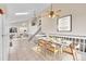 Open concept living and dining space with a staircase and lots of natural light at 598 Arden Cir, Highlands Ranch, CO 80126