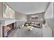 Comfortable living room with a fireplace, plush seating, and carpet at 598 Arden Cir, Highlands Ranch, CO 80126