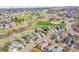 Aerial view showcases house in neighborhood near park, schools, and other residential properties at 598 Arden Cir, Highlands Ranch, CO 80126