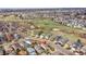 Aerial view highlights house in a neighborhood surrounded by residential homes and open space at 598 Arden Cir, Highlands Ranch, CO 80126